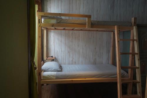 a couple of bunk beds in a room at The Pink House in Faja Grande