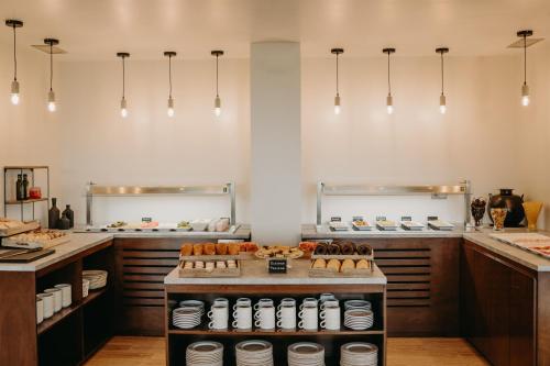 Кухня или мини-кухня в Abba Comillas Hotel
