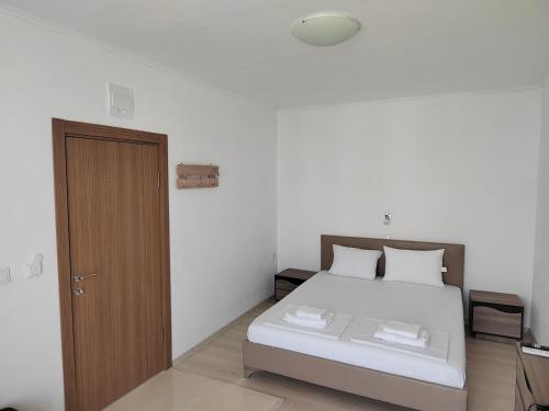 Postel nebo postele na pokoji v ubytování ARIA