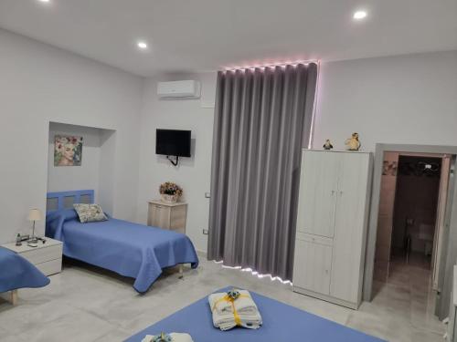 Ένα ή περισσότερα κρεβάτια σε δωμάτιο στο Miriam's House Pompei