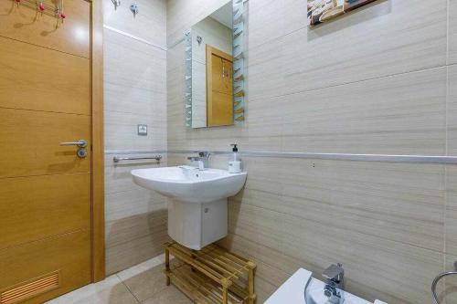 a bathroom with a sink and a mirror at A&N La Vega 2 in Torre del Mar