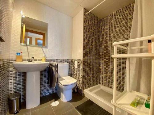 a bathroom with a sink and a toilet and a shower at A&N Spacious Family Retreat with Pool & Parking in Torre del Mar