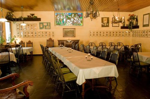 a dining room with tables and chairs in it at Moselstern Hotel Brixiade &Triton in Cochem