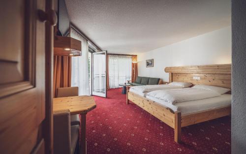 Säng eller sängar i ett rum på Club Hotel Davos by Mountain Hotels