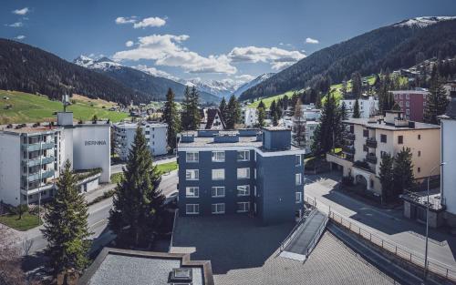 an aerial view of a city with mountains at Club Hotel rooms only - by Mountain Hotels in Davos
