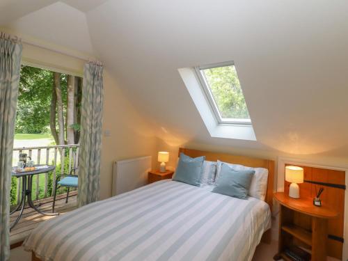 Ένα ή περισσότερα κρεβάτια σε δωμάτιο στο Spindlewood Cottage