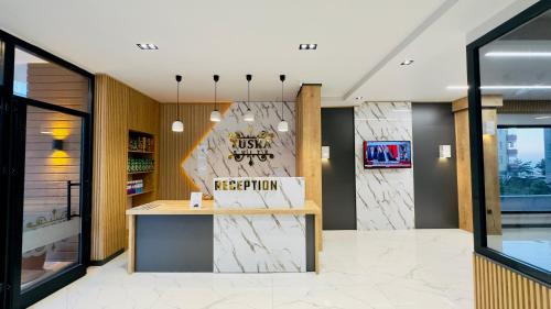 a lobby of a restaurant with a reception counter at Yusra Apart Otel in Trabzon