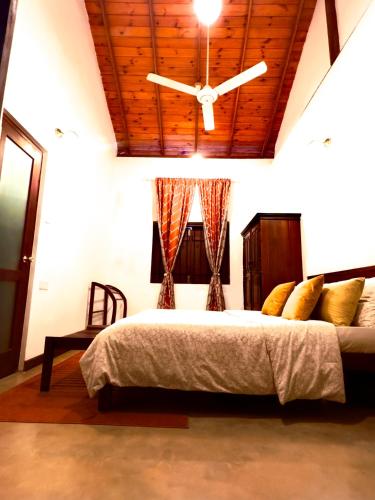 Postel nebo postele na pokoji v ubytování Colonial Residence Kandy