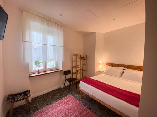 Postel nebo postele na pokoji v ubytování Taffetà b&b