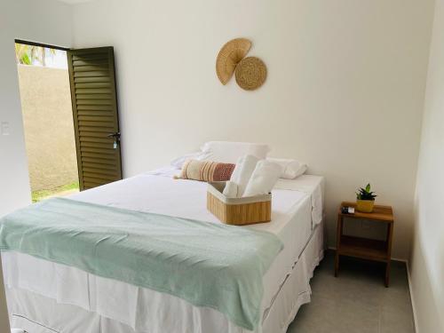 Postel nebo postele na pokoji v ubytování Casa Costa dos Milagres