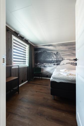 Ένα ή περισσότερα κρεβάτια σε δωμάτιο στο Lofoten Green Studio