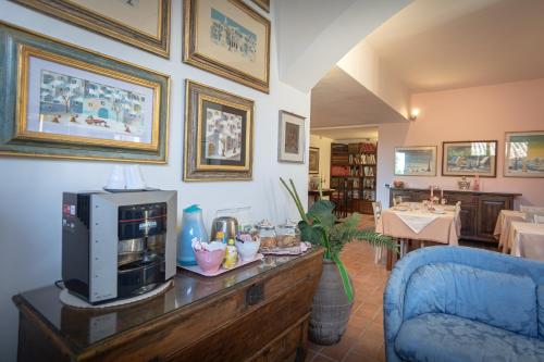 a living room with a tv on top of a table at B&B Il Chiostro Assisi in Assisi