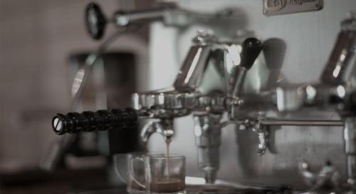a close up of a metal kitchen sink with glasses at La Saracina in Pienza