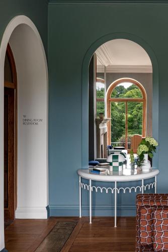 a room with a table and a window at Cowley Manor Experimental in Cheltenham