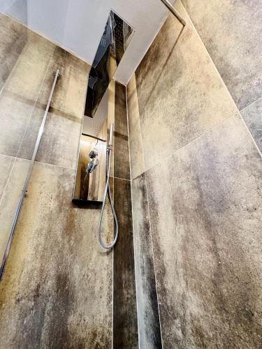 a bathroom with a shower with a glass door at San Marco View in Florence