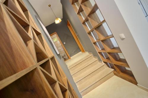 a staircase in a house with wooden doors at Boka Devine Residence in Kotor