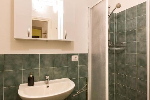 a bathroom with a sink and a mirror at Holiday House Esedra in Rome
