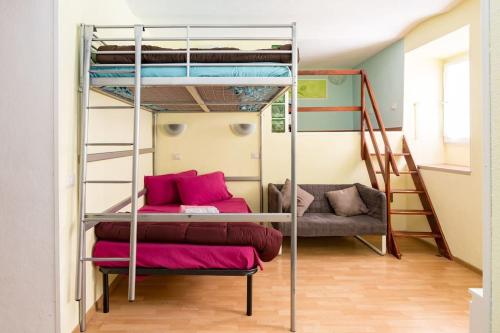 a room with two bunk beds and a couch at Holiday House Esedra in Rome