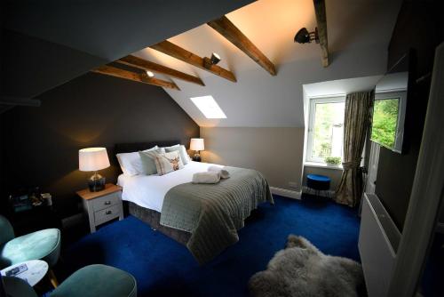 a bedroom with a bed and a window at Rockview in Portree