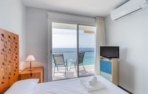 a bedroom with a bed and a view of the ocean at Mar de Moravit by Nora Nice in Moraira