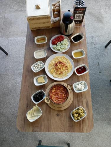 a wooden table with food on top of it at Erdoğan Konut in Çaykara