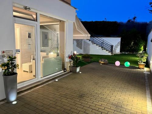 a patio with a sliding glass door in a house at B&B SANGIORGIO Green living in Melpignano