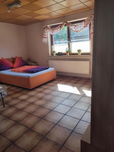 Postel nebo postele na pokoji v ubytování Appartement am Waldesrand