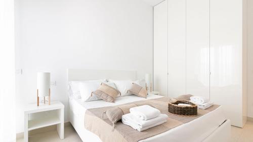 Ένα ή περισσότερα κρεβάτια σε δωμάτιο στο Rivazzurra Homes - C