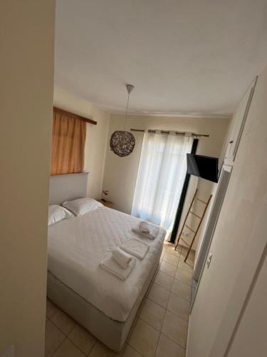 Ένα ή περισσότερα κρεβάτια σε δωμάτιο στο Anoixi Apartments