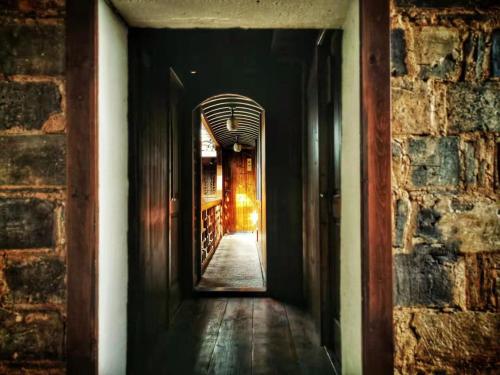 an empty hallway with a hallway leading into a building at Alina Garden Boutique Resort Huangshan Hongcun in Huangshan Scenic Area