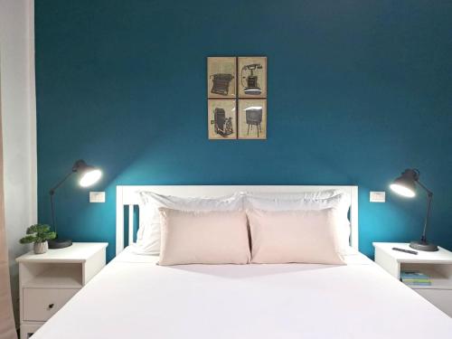 Posteľ alebo postele v izbe v ubytovaní Ajana Rooms by Accomodo