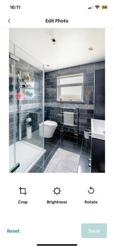 a bathroom with a shower and a sink and a tub at Beautiful double bedroom in Hillingdon