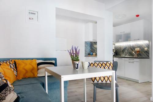 a living room with a couch and a table at Okean Apartments in Ierissos