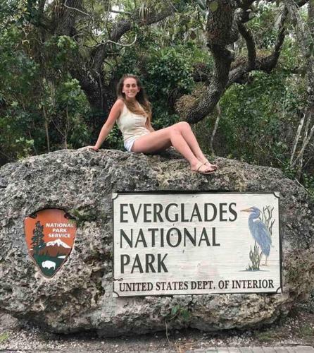 a woman sitting on top of a rock at Alma Guest Suite in Miami