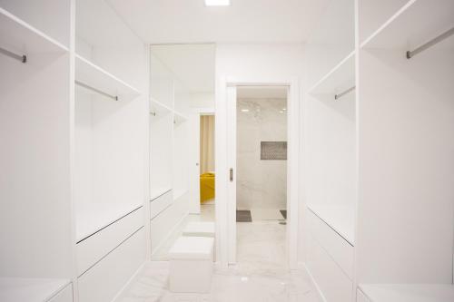 a white hallway with white walls and white floors at Pérola dos Anjos by LovelyStay in Funchal