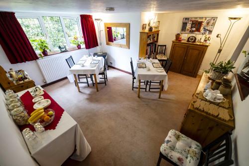 an overhead view of a dining room with tables and chairs at Southdown B&B in Clovelly
