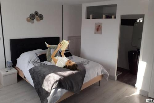 Ένα ή περισσότερα κρεβάτια σε δωμάτιο στο La Douce Parenthèse - 3 chambres d'hôtes-Accueil motards