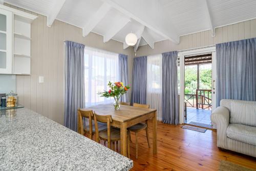 a kitchen with a table and a dining room at The Slipway in Colchester