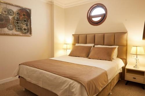Postel nebo postele na pokoji v ubytování Kaira Hotel& Aparts