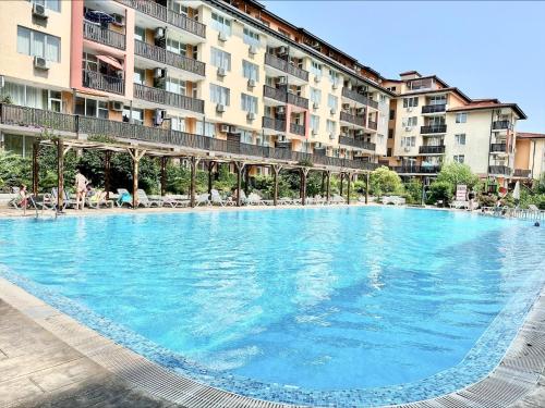 a large swimming pool in front of a building at Chateau Aheloy 2 - Menada Apartments in Aheloy