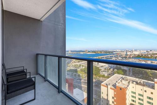 an apartment balcony with a view of the city at Corner condo w/ Unrivaled views in Miami
