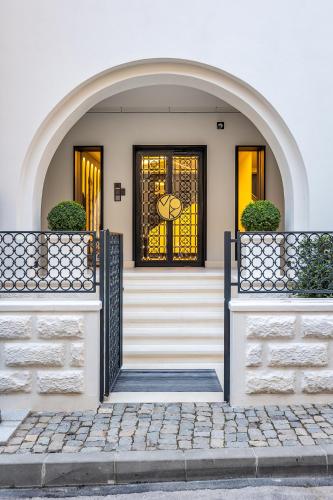 a front door of a house with a gate at Rosetti One in Constanţa