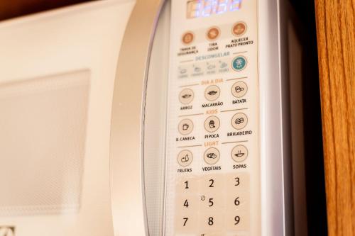 a close up of the control panel of a microwave at Suites em Jabaquara, Paraty in Paraty
