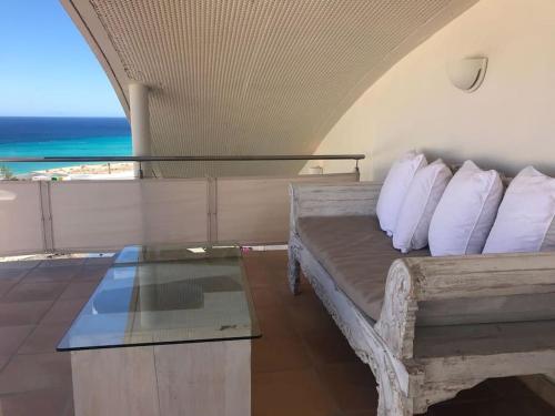 a bedroom with a bed with a view of the ocean at Premium Residence Isabel in Costa Calma