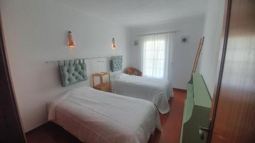 Katil atau katil-katil dalam bilik di Vila T2 Algarve piscina privada