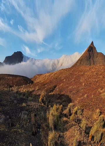 a view of a mountain with clouds in the background at Premium Residence Isabel in Costa Calma