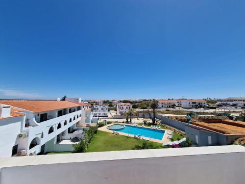 a view of the pool from the balcony of a apartment at Brand New Apartment in Sagres in Sagres