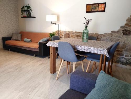 a dining room with a table and chairs at Casa Aldea de Abaixo in Lugo