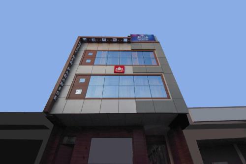 a tall building with a lot of windows at Collection O Red Paradise in Zirakpur
