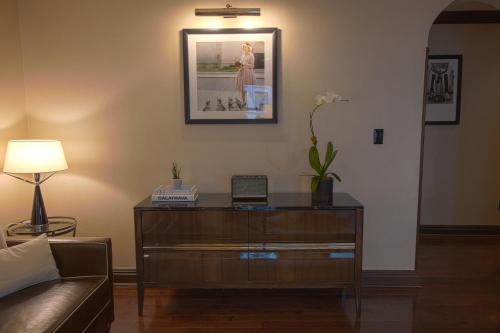 a living room with a dresser and a couch at Iroquois New York Times Square in New York